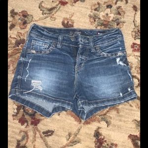 The brand is Silver and they are denim shorts.